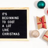 holiday spending quote sign
