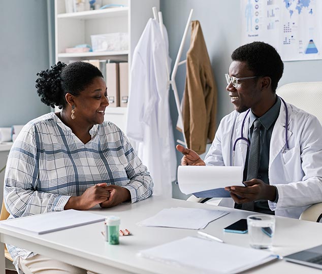 overweight woman seeing diet doctor about weightloss medicine