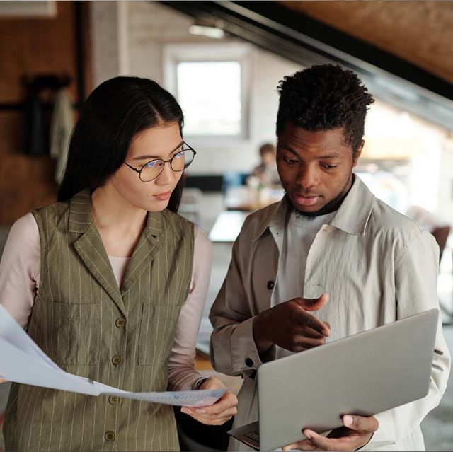 coworkers conversation looking at documents