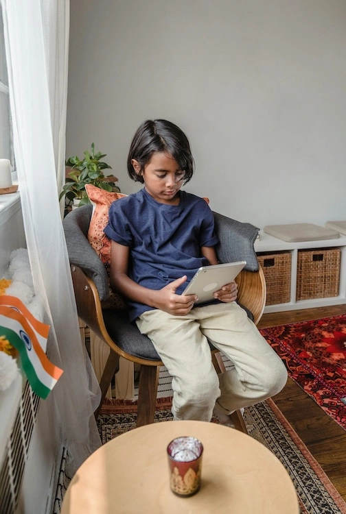 Child on tablet.