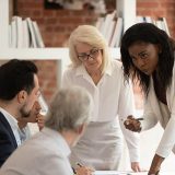 black woman with coworkers