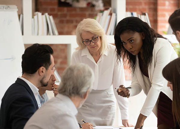 black woman with coworkers