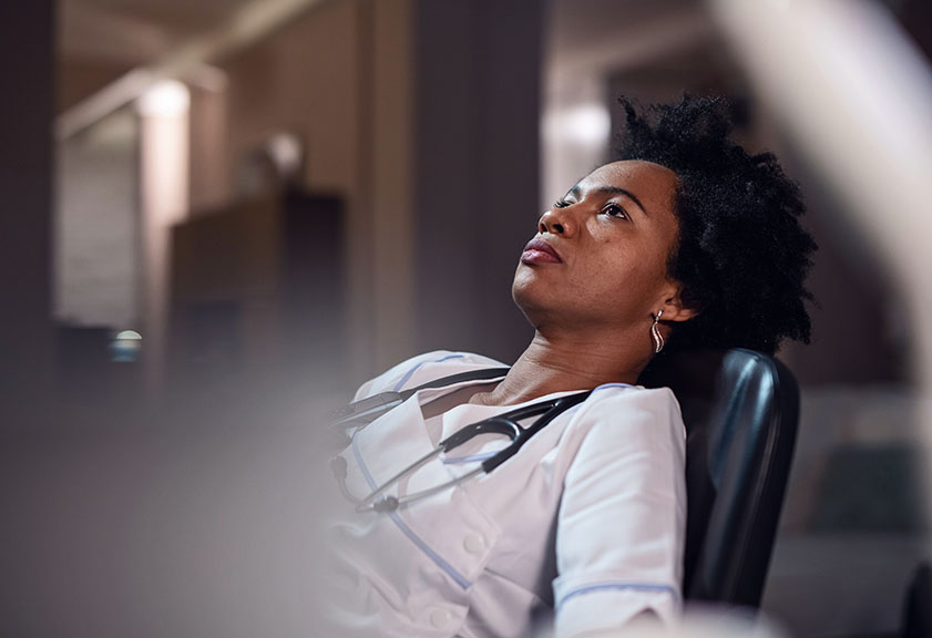 black woman stressed angry about microaggressions in the office