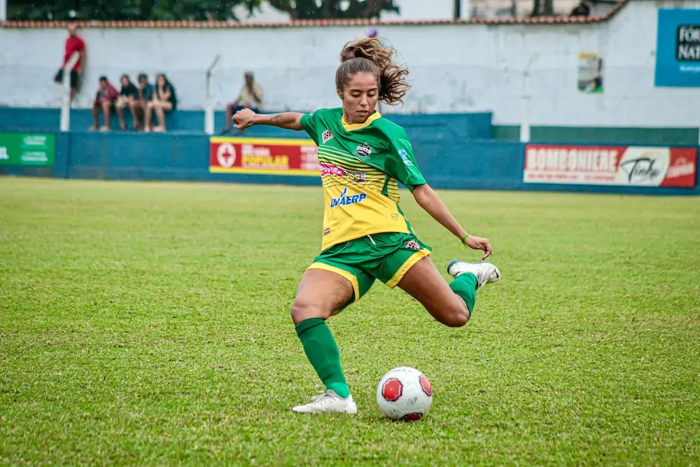 A woman soccer player.