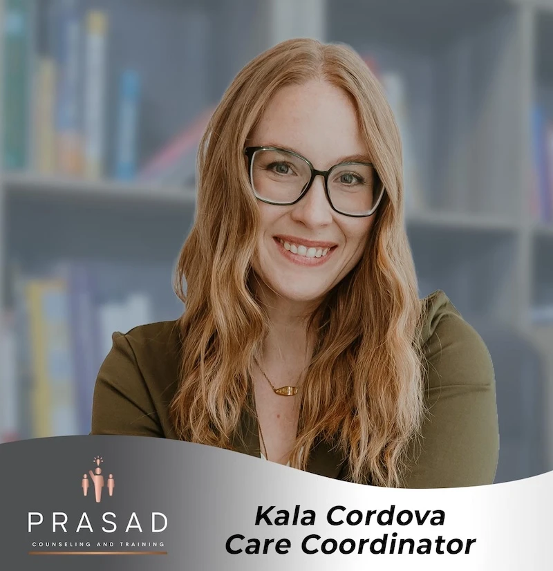 PrasadCounselingAndTraining-Kala-headshot-with-banner Headshot of Kala with a company banner.