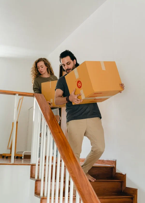 PrasadCounselingAndTraining-Couple-lifting-boxes-in-the-stairs Couple lifting boxes in the stairs